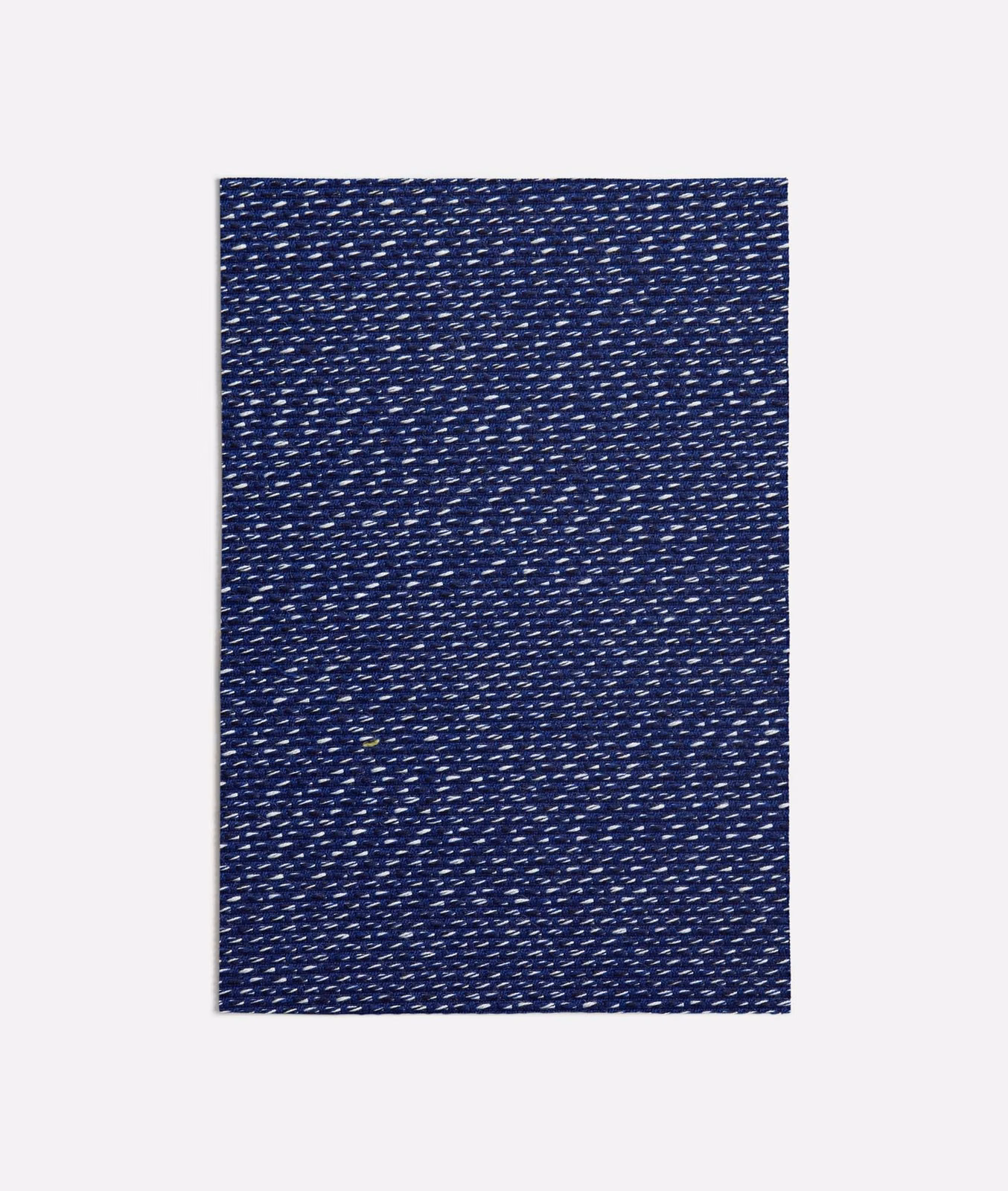 Deep navy woven textile with dense pale flecks and a subtly textured surface
