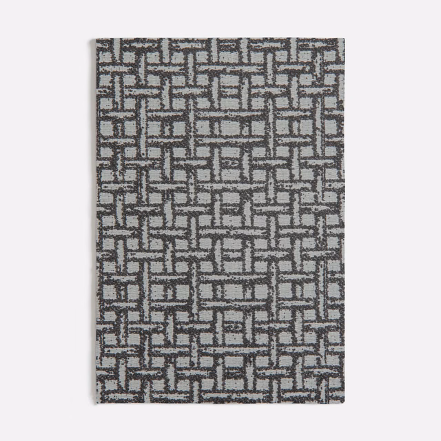 Charcoal and grey woven fabric with an interlocking rectangular maze motif