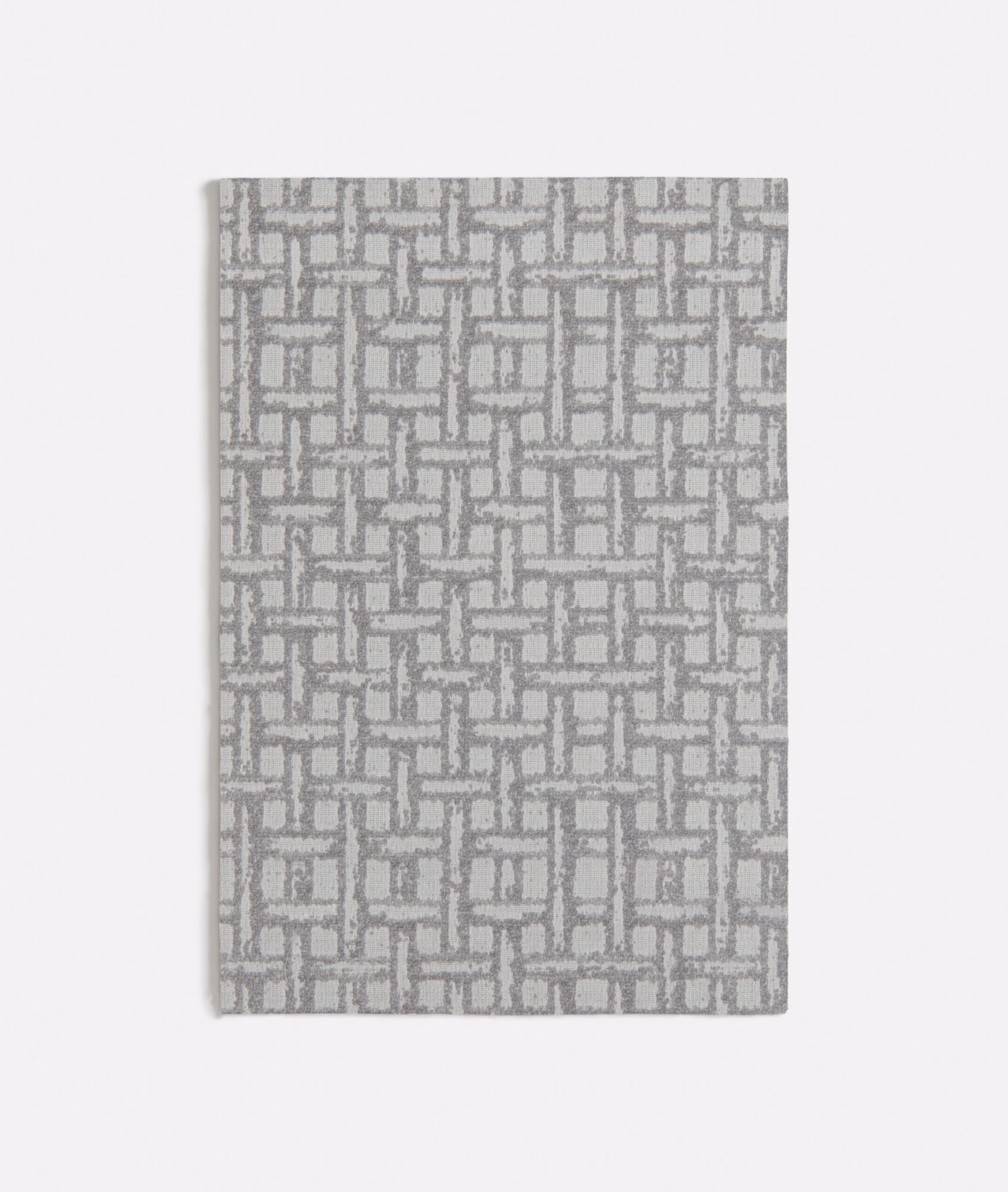Warm grey woven swatch with small interlocking rectangular rattan-style geometric pattern