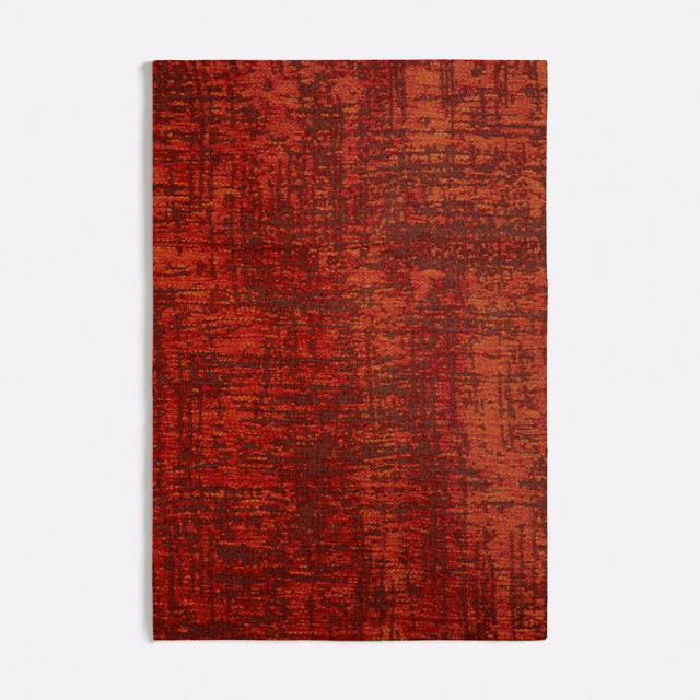 Dense rust-orange swatch with irregular red-brown woven striations and distressed texture
