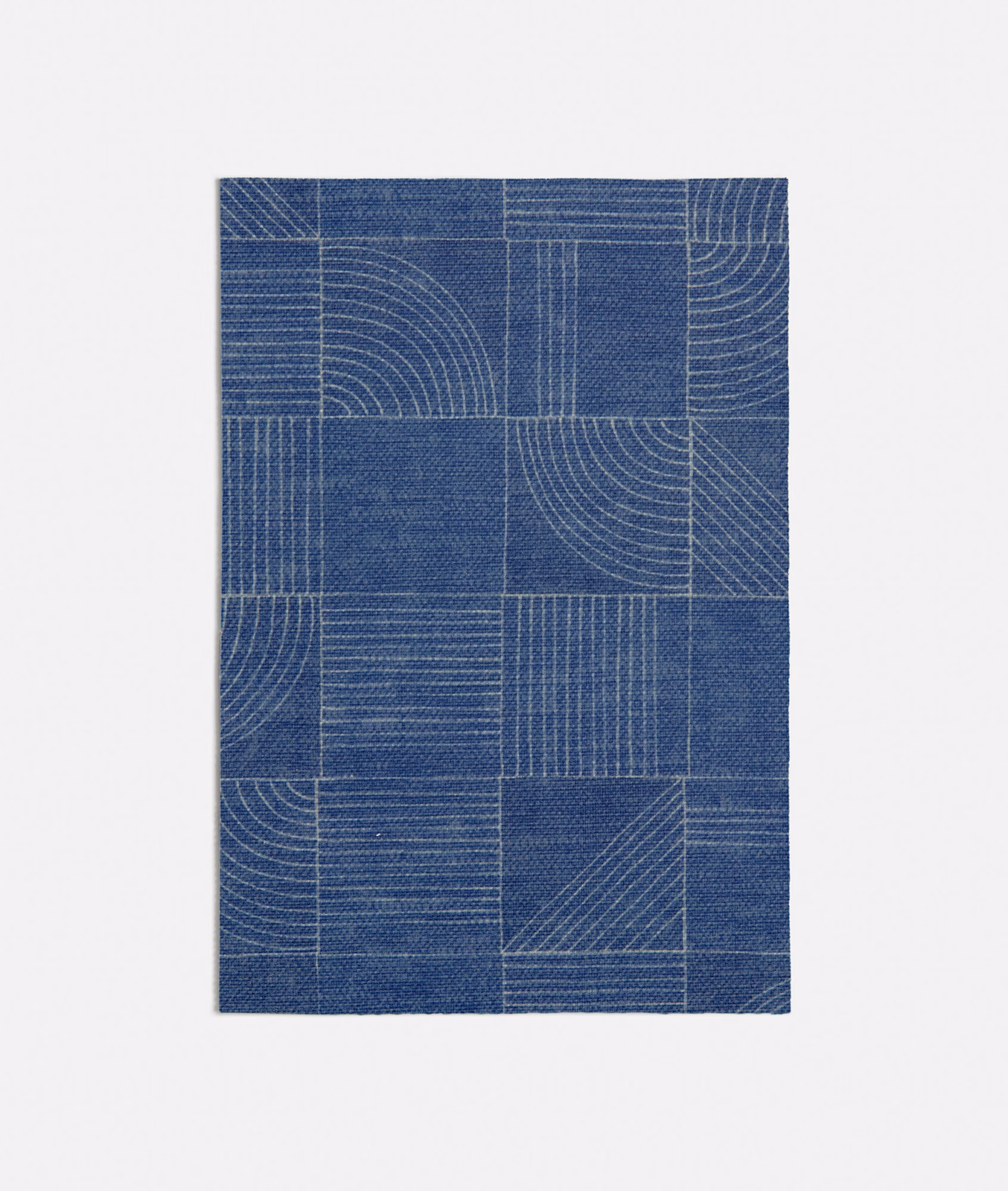 Deep denim-blue woven swatch with rectangular panels, arcs and pale linear detailing