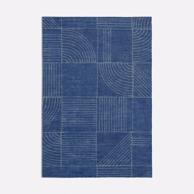 Deep denim-blue woven swatch with rectangular panels, arcs and pale linear detailing