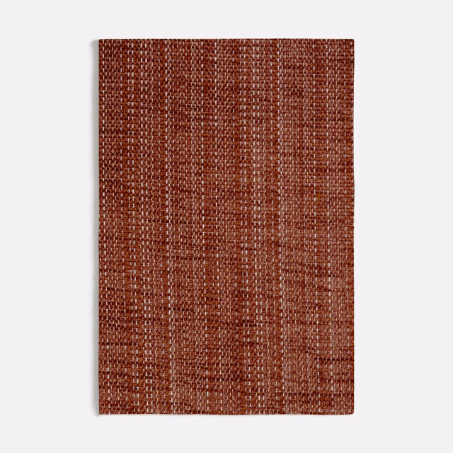 Warm terracotta chenille with irregular vertical flecks and a softly nubby weave
