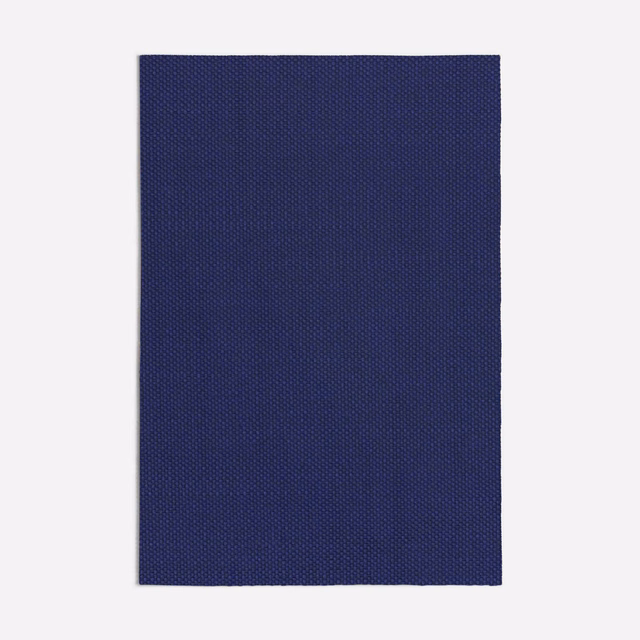 Deep indigo-blue fabric swatch with a fine, densely woven pinpoint texture