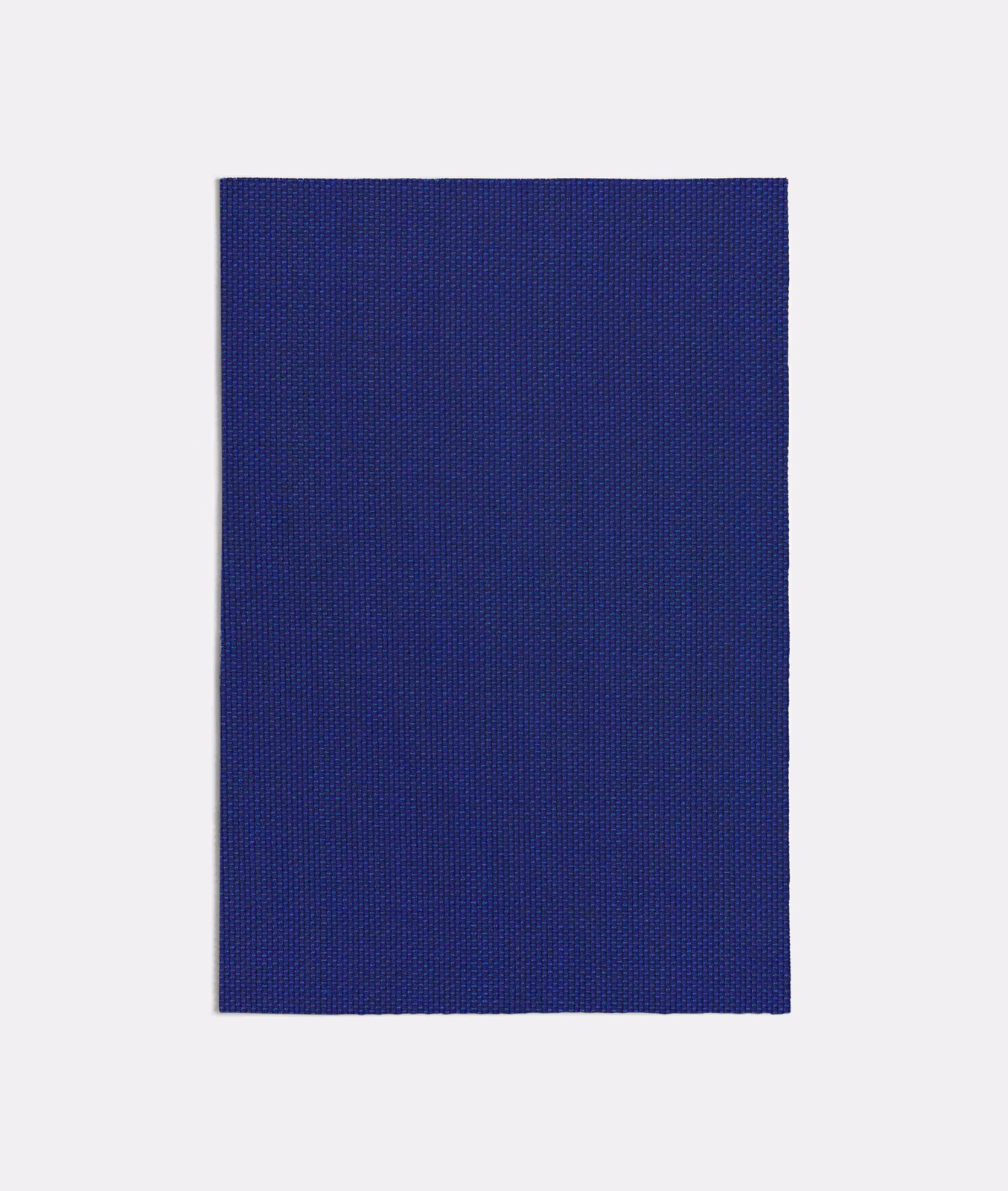 Deep indigo-blue fabric swatch showing a fine, even woven texture