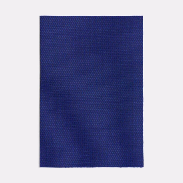 Deep indigo-blue fabric swatch showing a fine, even woven texture