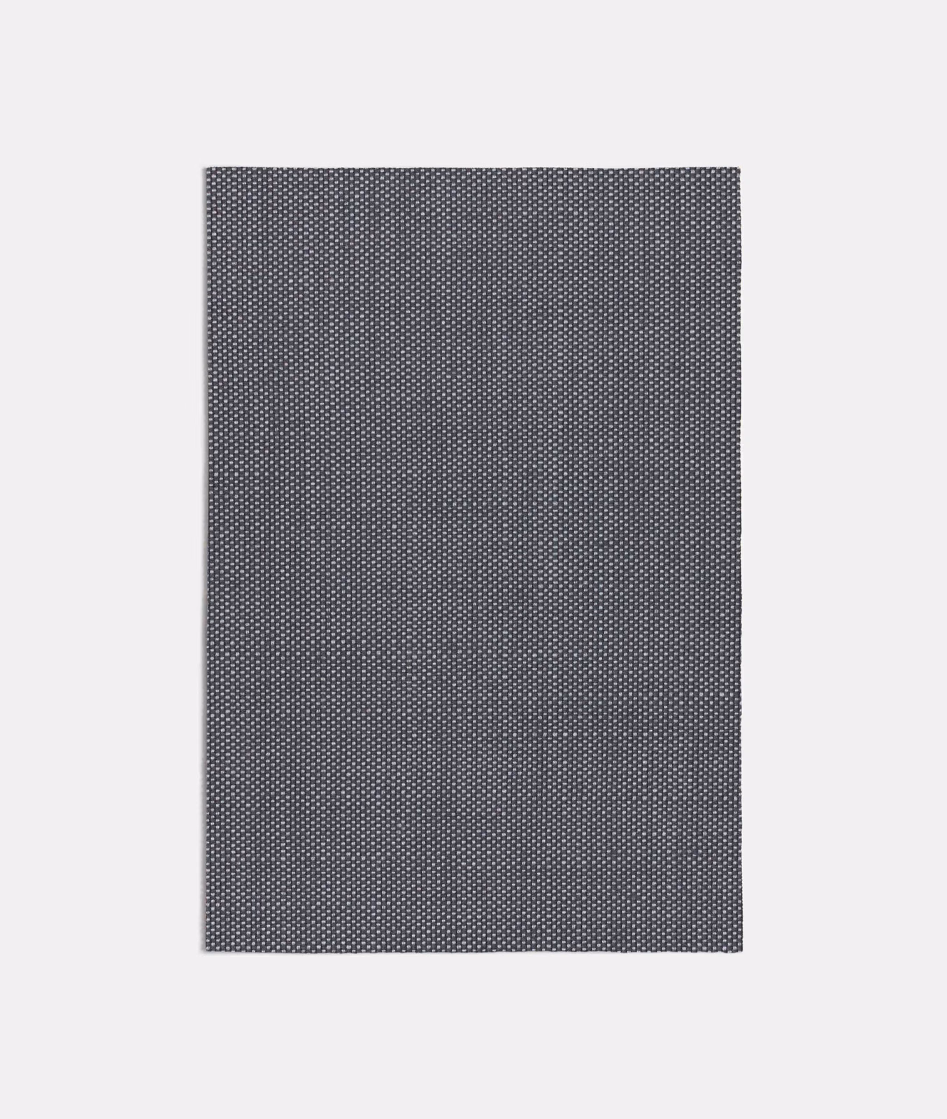 Cool charcoal-grey fabric with a dense, fine geometric micro-weave