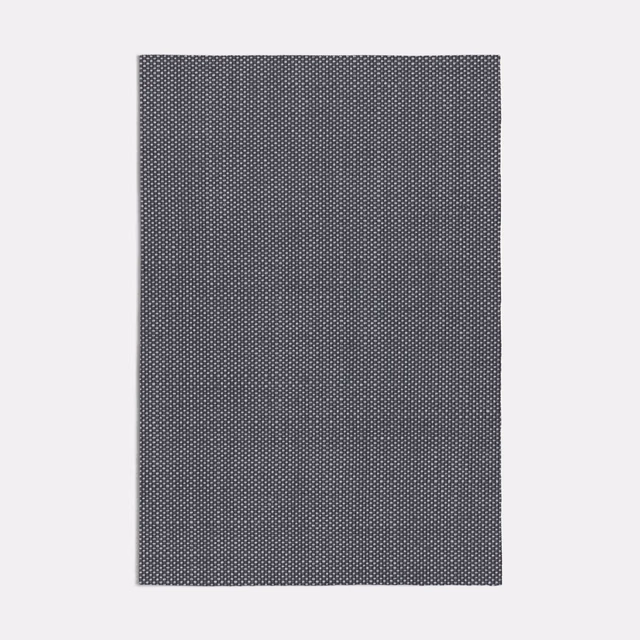 Cool charcoal-grey fabric with a dense, fine geometric micro-weave
