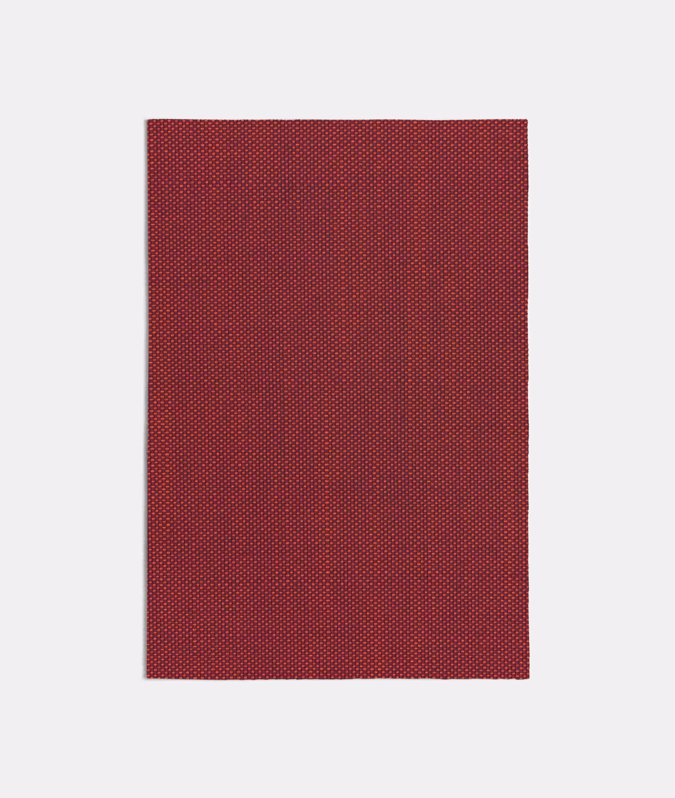 Deep terracotta-red woven swatch with fine, regular dotted texture