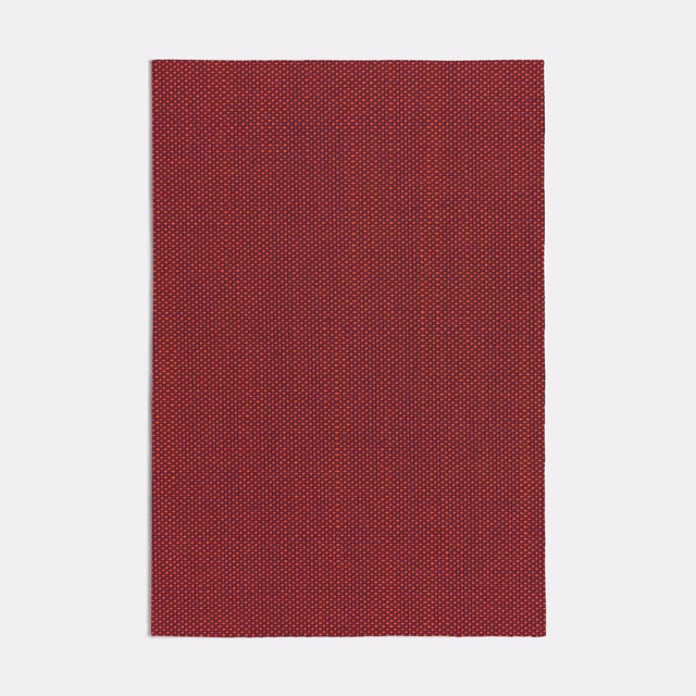 Deep terracotta-red woven swatch with fine, regular dotted texture