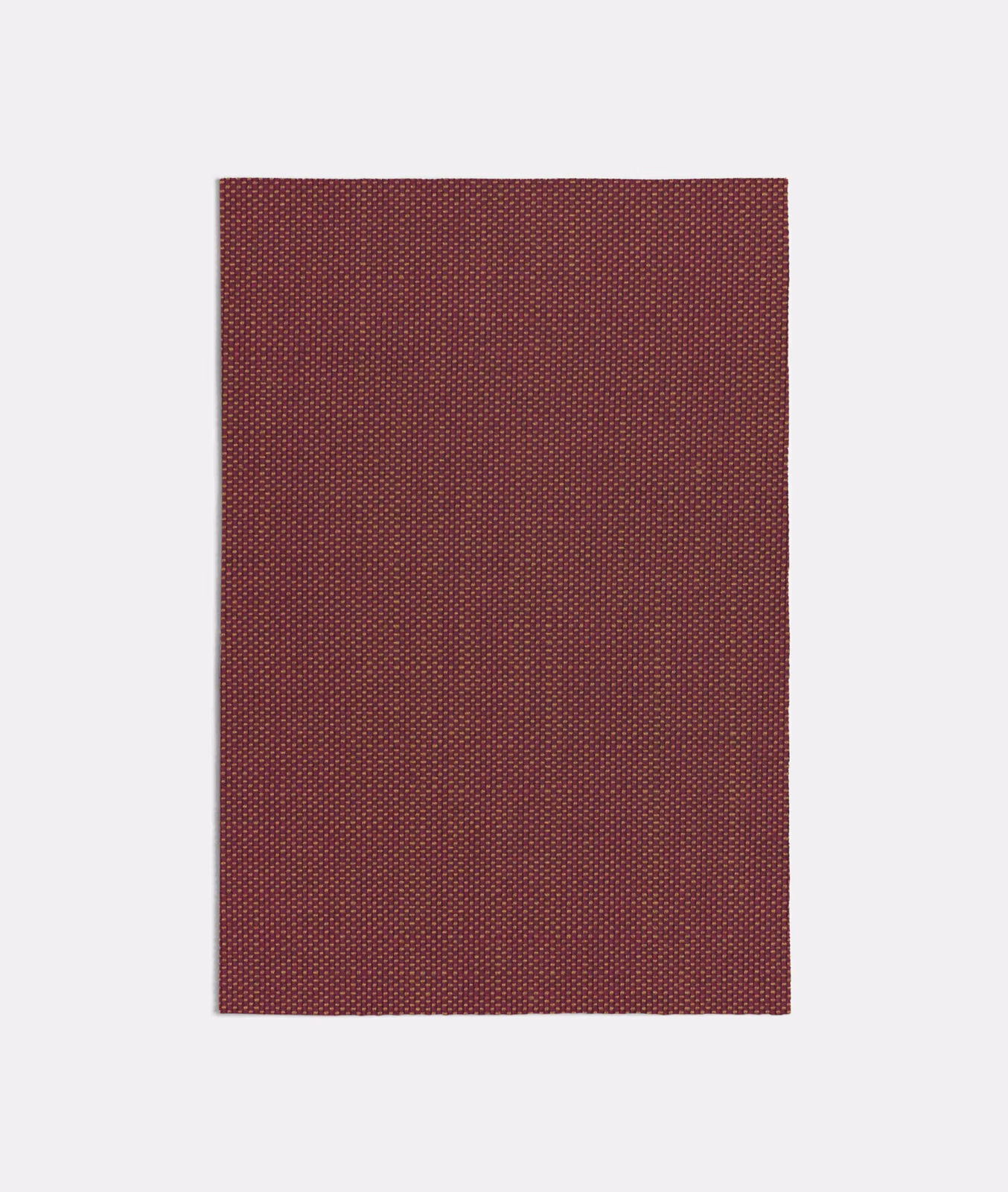 Deep terracotta-red woven swatch with a fine, regular micro-pattern and subtle texture