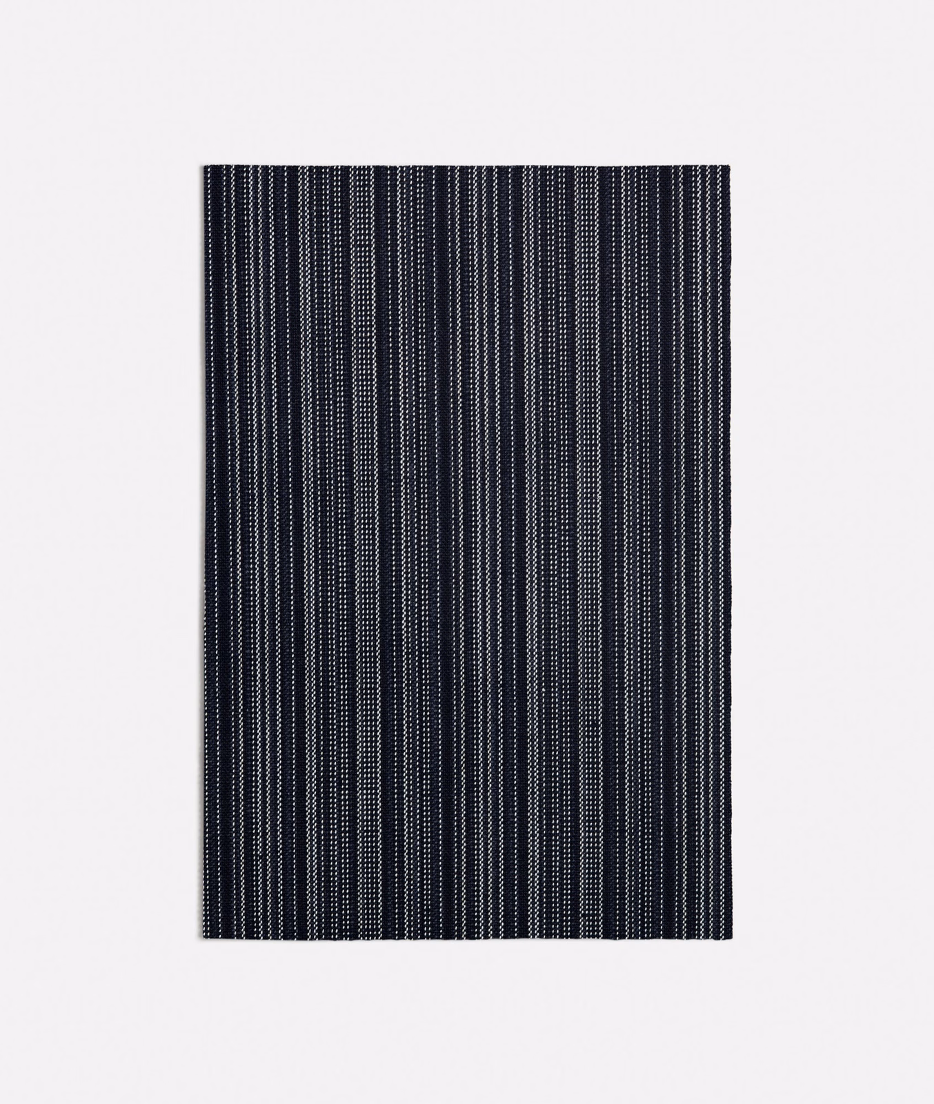 Deep ink-blue woven swatch with closely spaced vertical dotted stripes