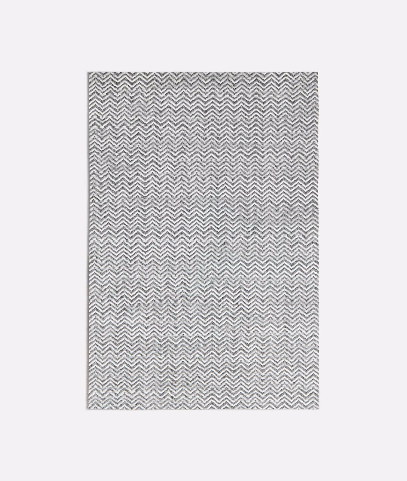 Cool dark grey fabric with a tightly woven pale ivory chevron pattern