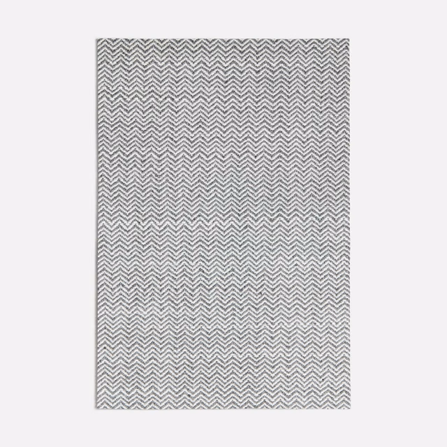 Cool dark grey fabric with a tightly woven pale ivory chevron pattern
