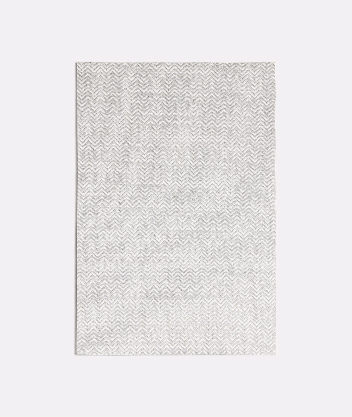 Pale cool-grey fabric swatch with a fine woven chevron herringbone texture