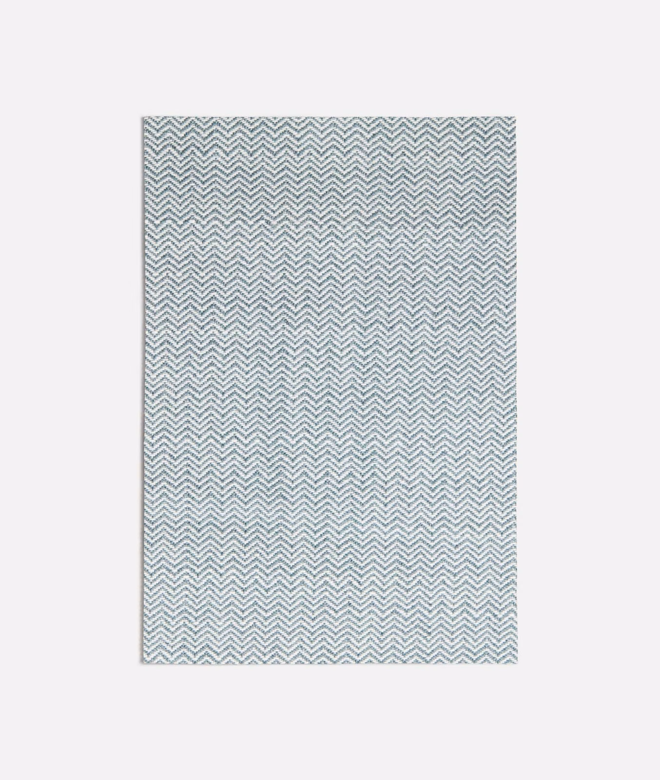 Pale seafoam fabric swatch with fine repeating white chevron weave and subtle texture