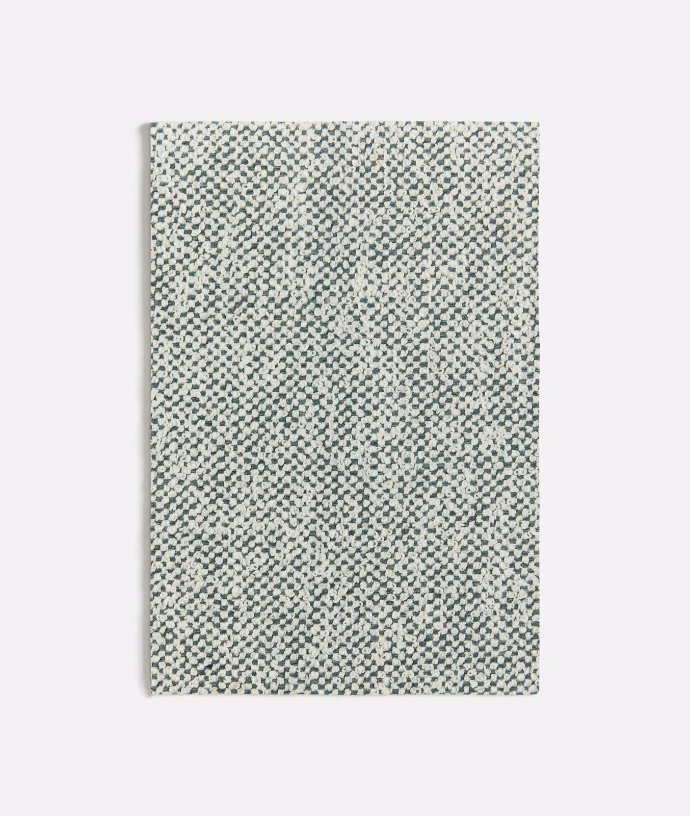 Pale seafoam fabric with dense tiny charcoal and cream geometric woven flecks