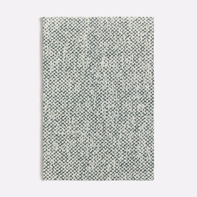 Pale seafoam fabric with dense tiny charcoal and cream geometric woven flecks