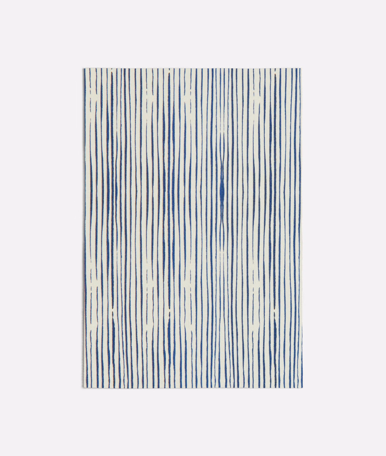 Ivory textile with irregular vertical ink-blue lines and a lightly textured surface