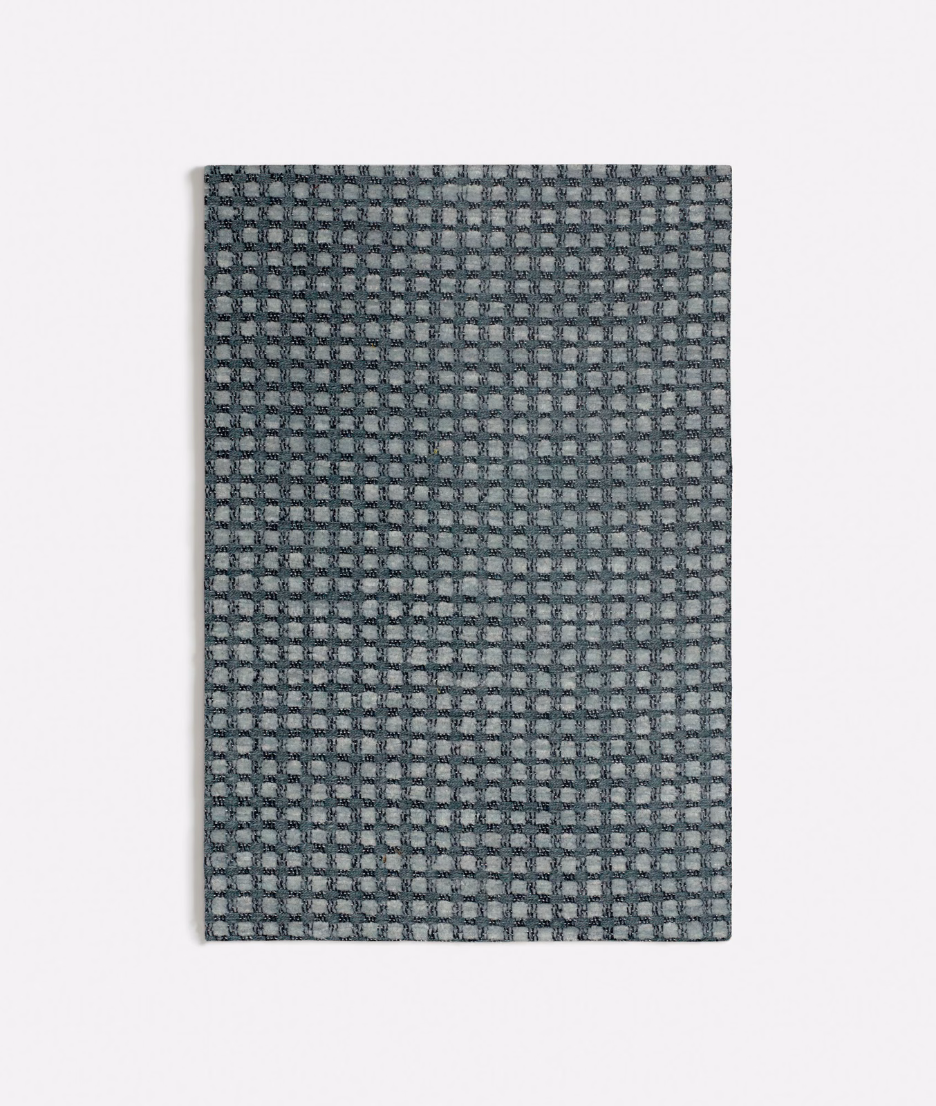Muted seafoam, grey and charcoal small-check woven textile close-up