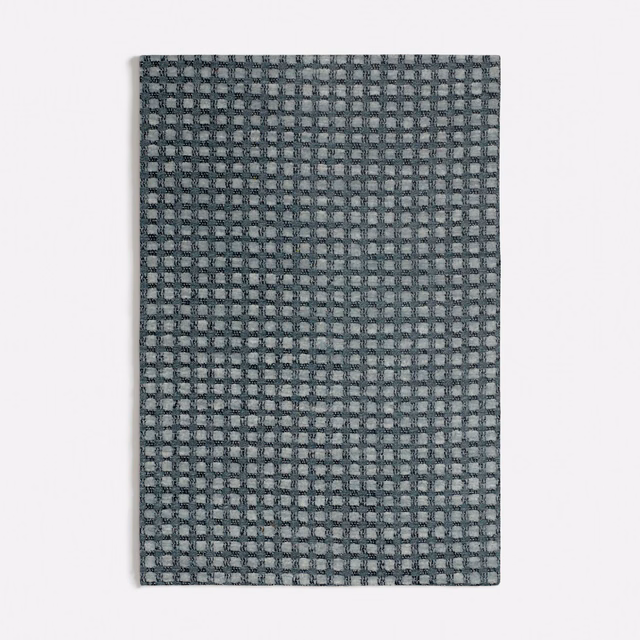 Muted seafoam, grey and charcoal small-check woven textile close-up