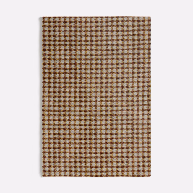 Warm spice-brown and cream tile checks in a compact woven fabric swatch