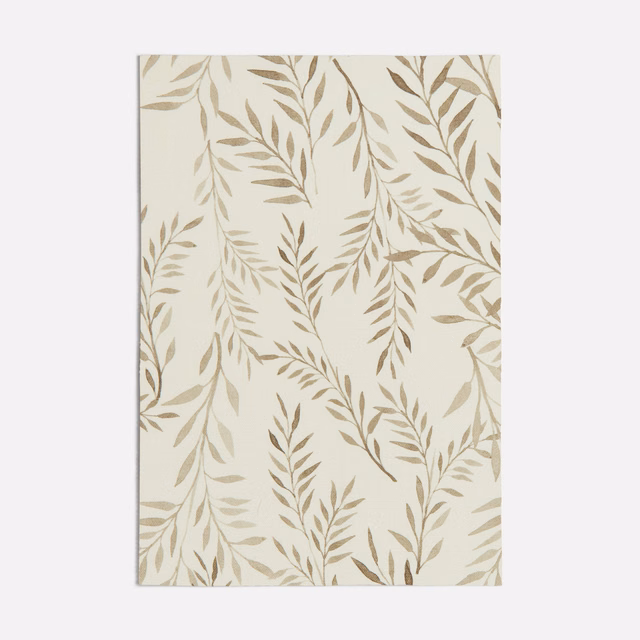 Warm cream fabric with trailing taupe leaf branches and a fine matte weave