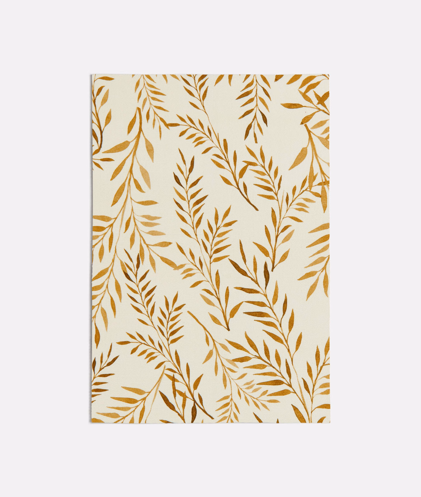 Ivory fabric with warm ochre leafy branches in an airy botanical pattern