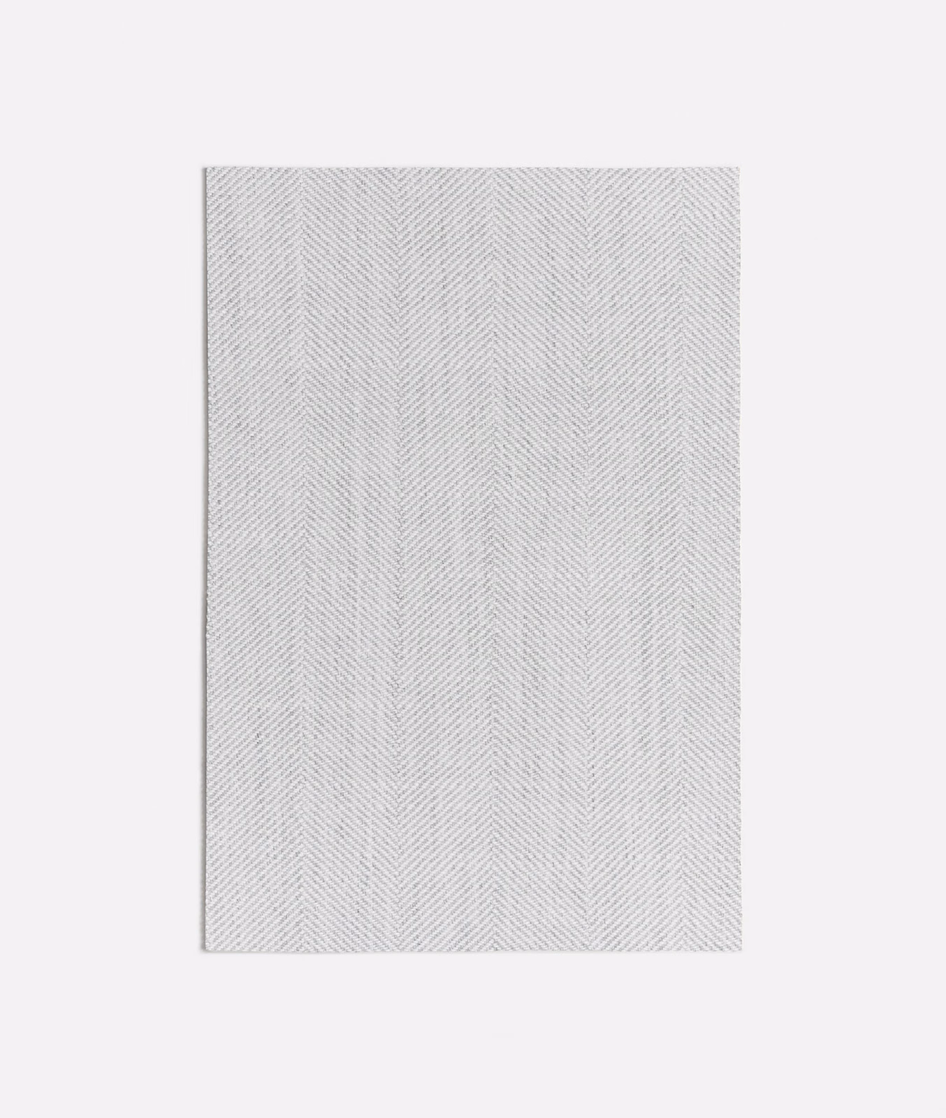 Pale taupe-grey textile with fine vertical herringbone columns and softly flecked weave