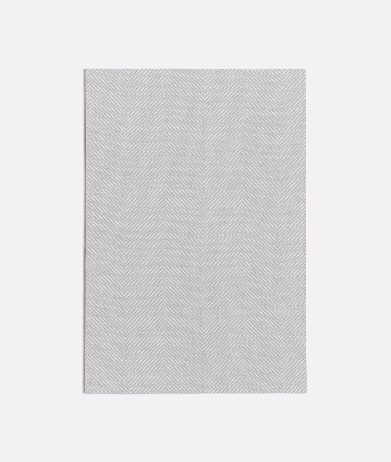 Pale greige textile with fine vertical chevron lines and a softly woven surface