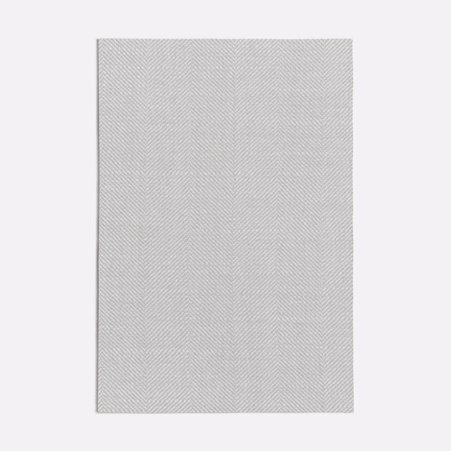 Pale greige textile with fine vertical chevron lines and a softly woven surface