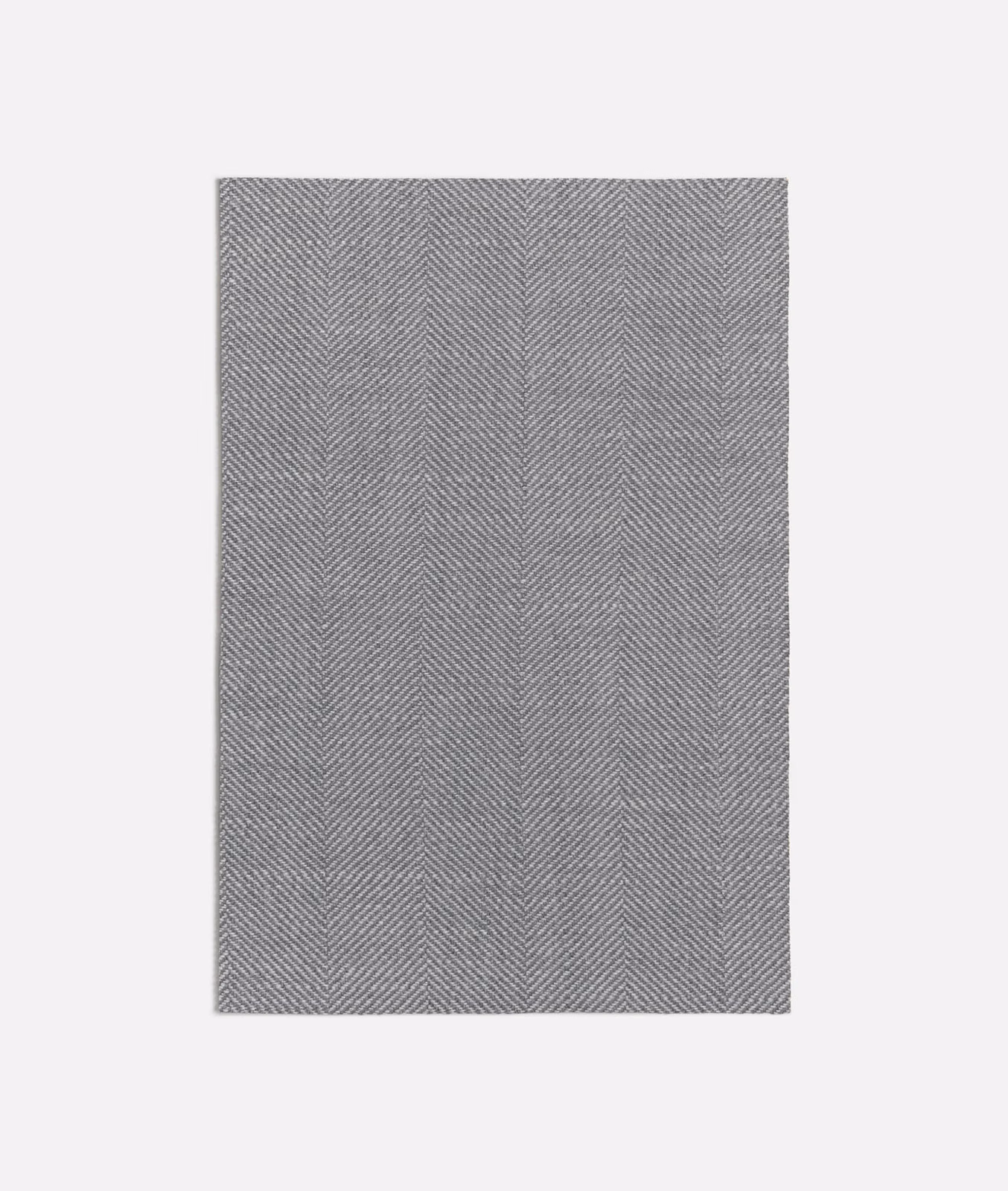 Warm tan-grey woven fabric with fine, closely spaced herringbone stripes