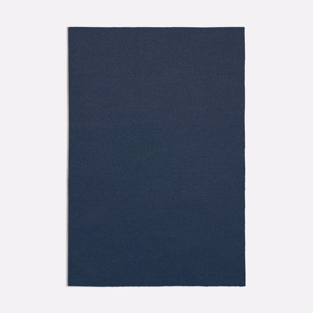 Deep navy blue plain woven fabric swatch with subtle fine surface texture