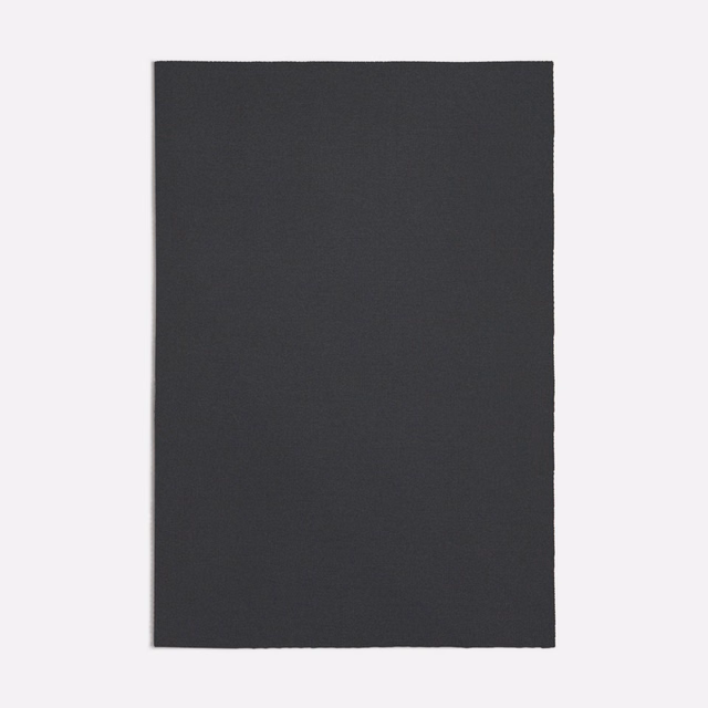 Dark charcoal-grey plain weave with a subtly dry, matte surface
