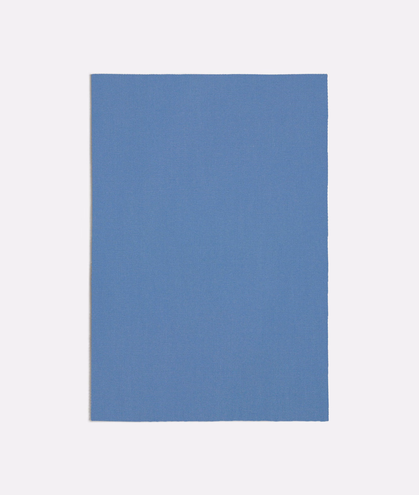 Cool muted blue plain-woven fabric swatch with a fine, even texture