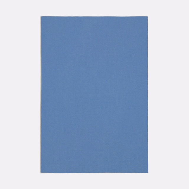 Cool muted blue plain-woven fabric swatch with a fine, even texture