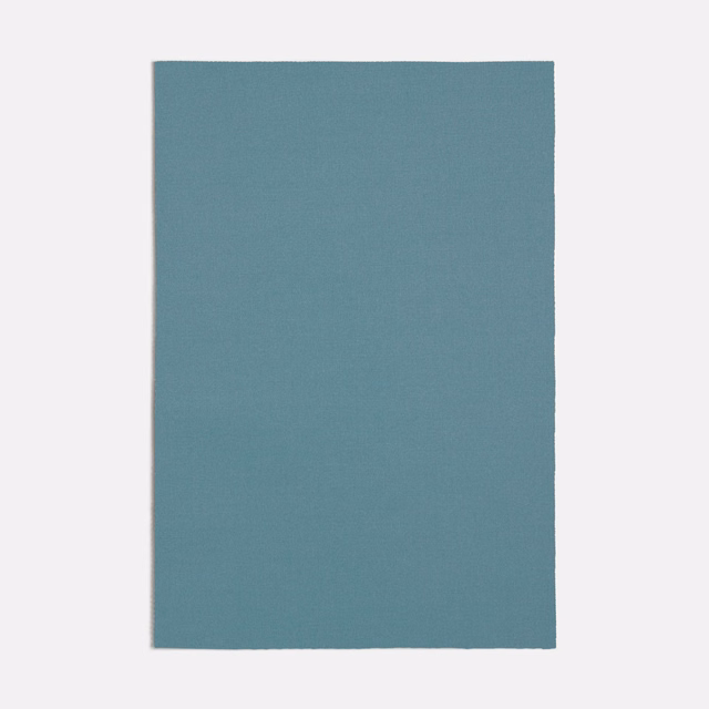 Muted light blue-teal fabric swatch showing a fine, even woven texture