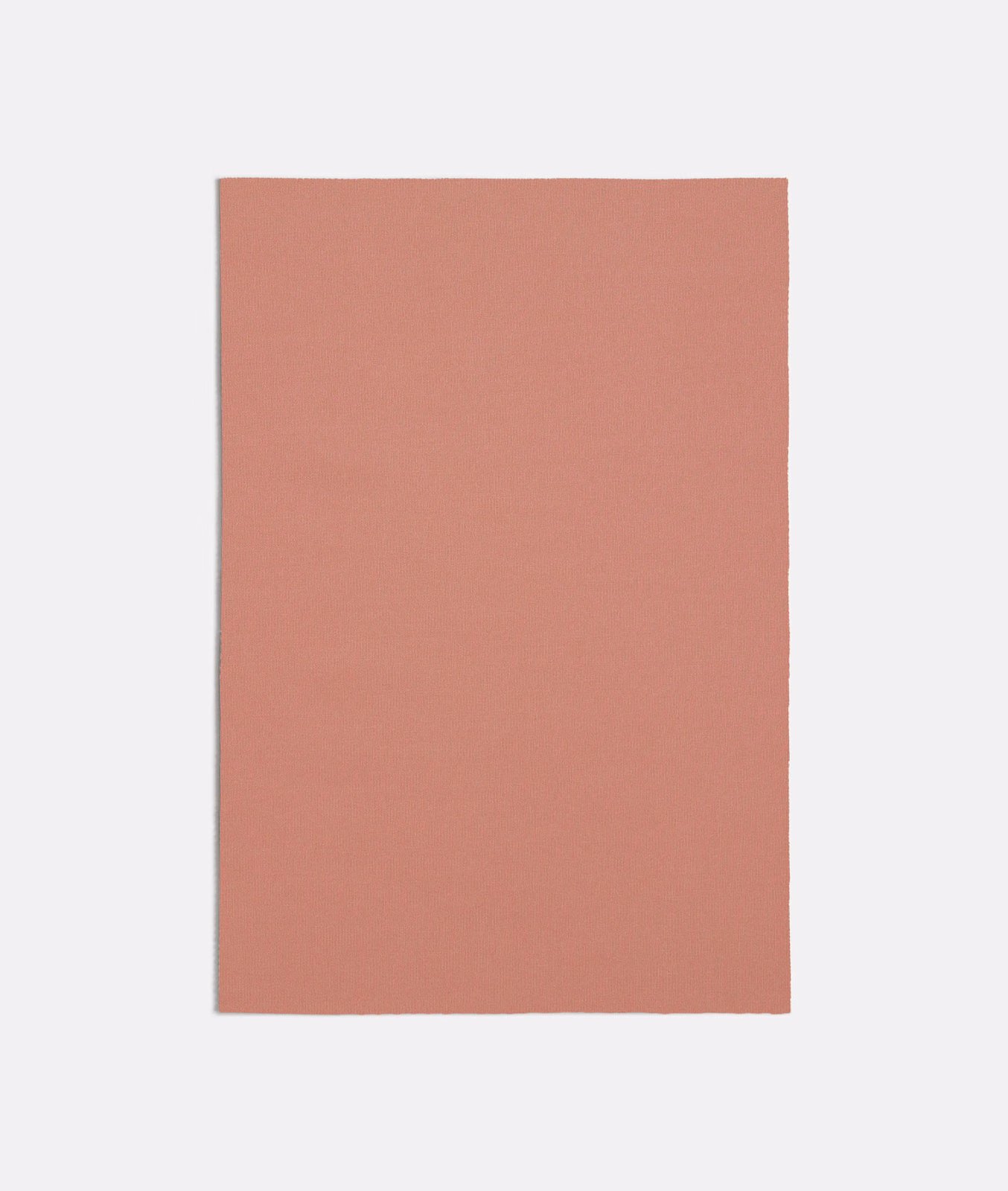 Muted dusty rose pink fabric swatch showing a fine, even woven texture