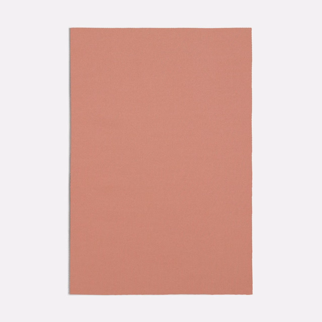 Muted dusty rose pink fabric swatch showing a fine, even woven texture