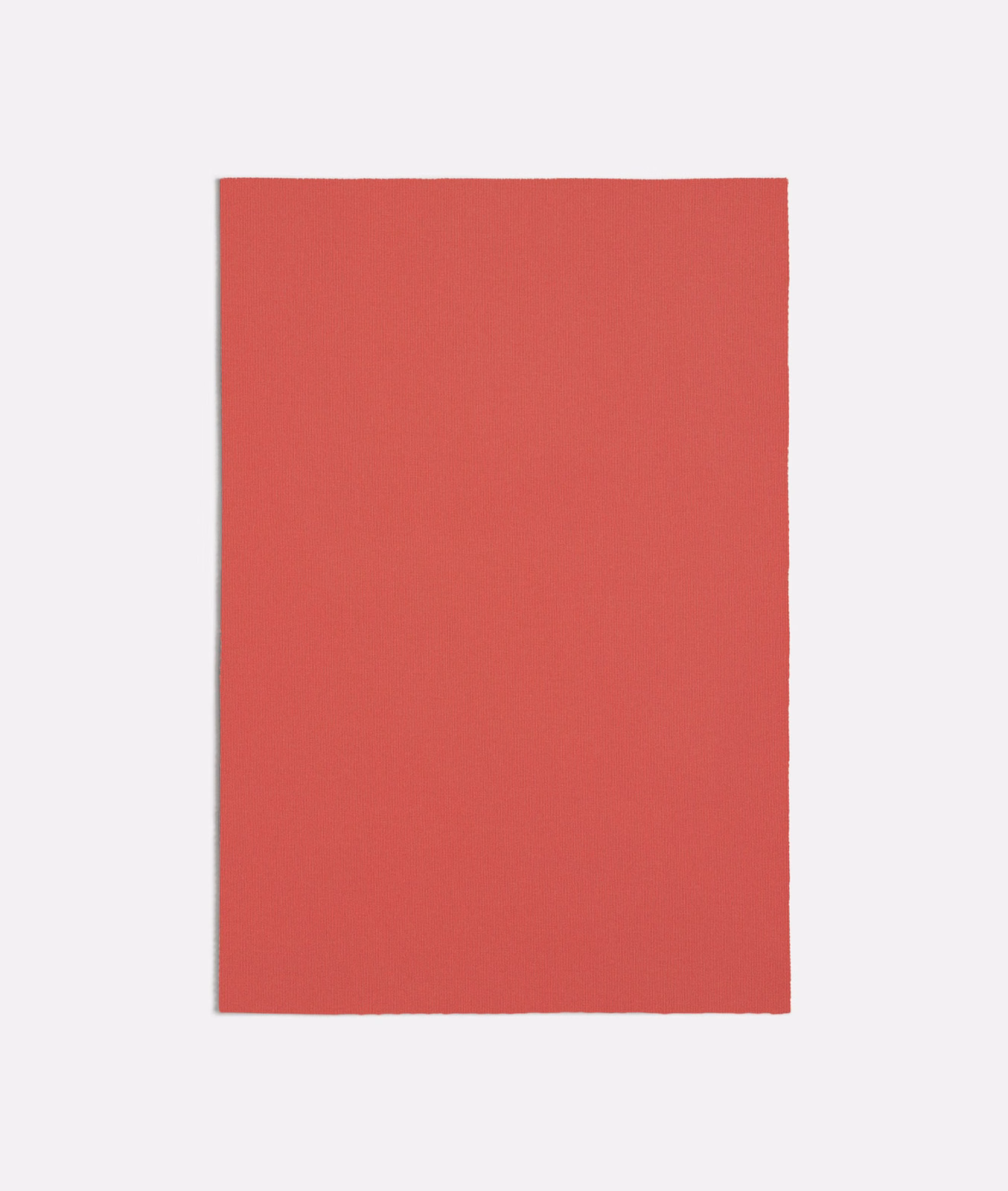 Muted pink-red plain fabric swatch with a fine, even matte texture