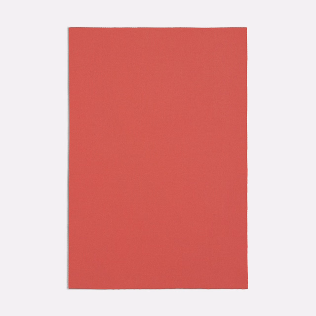Muted pink-red plain fabric swatch with a fine, even matte texture
