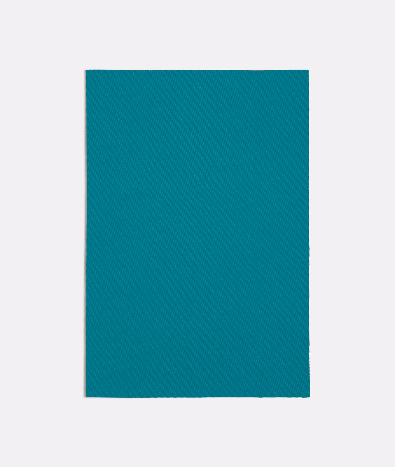 Saturated turquoise textile swatch with a fine, even woven surface