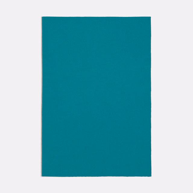 Saturated turquoise textile swatch with a fine, even woven surface