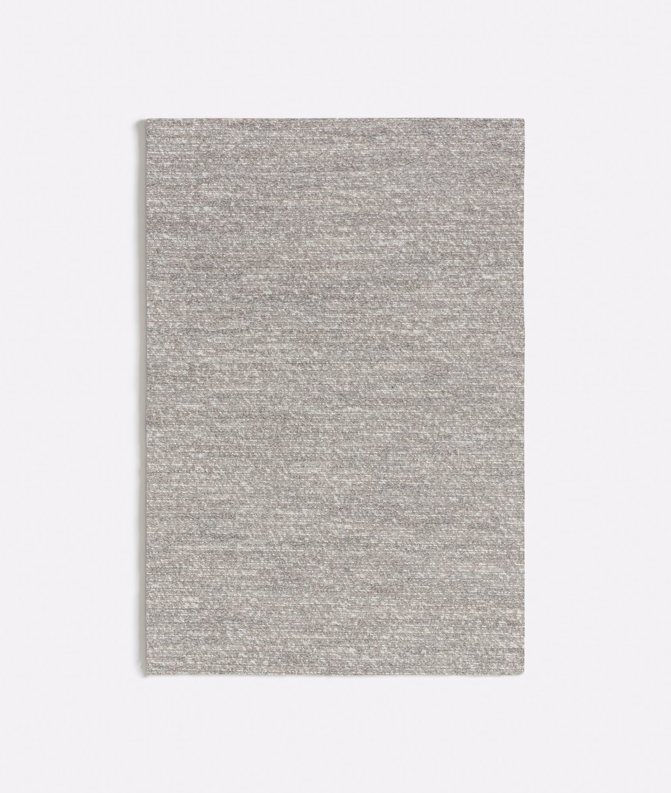 Close-up of cool light-grey Tricot textile with fine horizontal striations and mottled woven texture