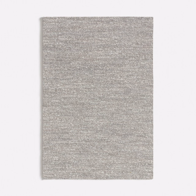 Close-up of cool light-grey Tricot textile with fine horizontal striations and mottled woven texture