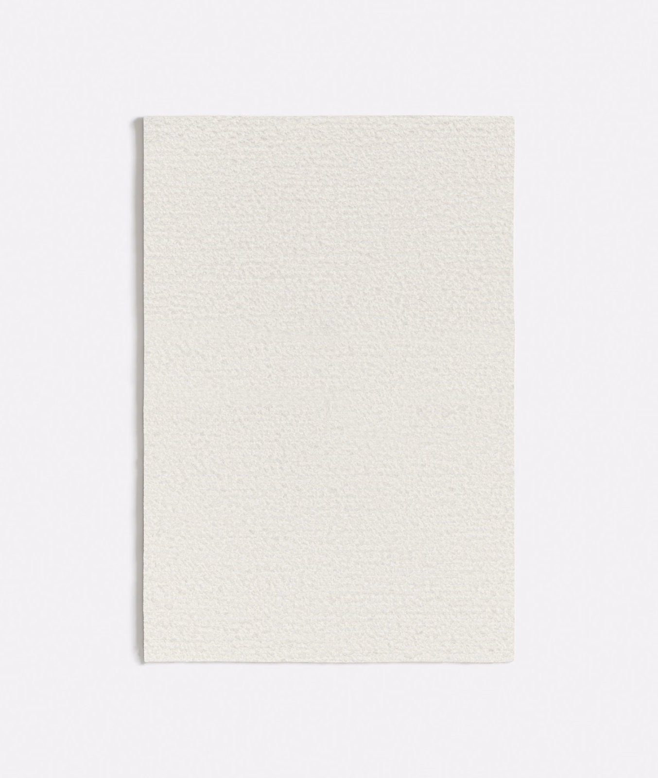 Soft warm white fabric swatch showing a fine, subtly pebbled woven texture