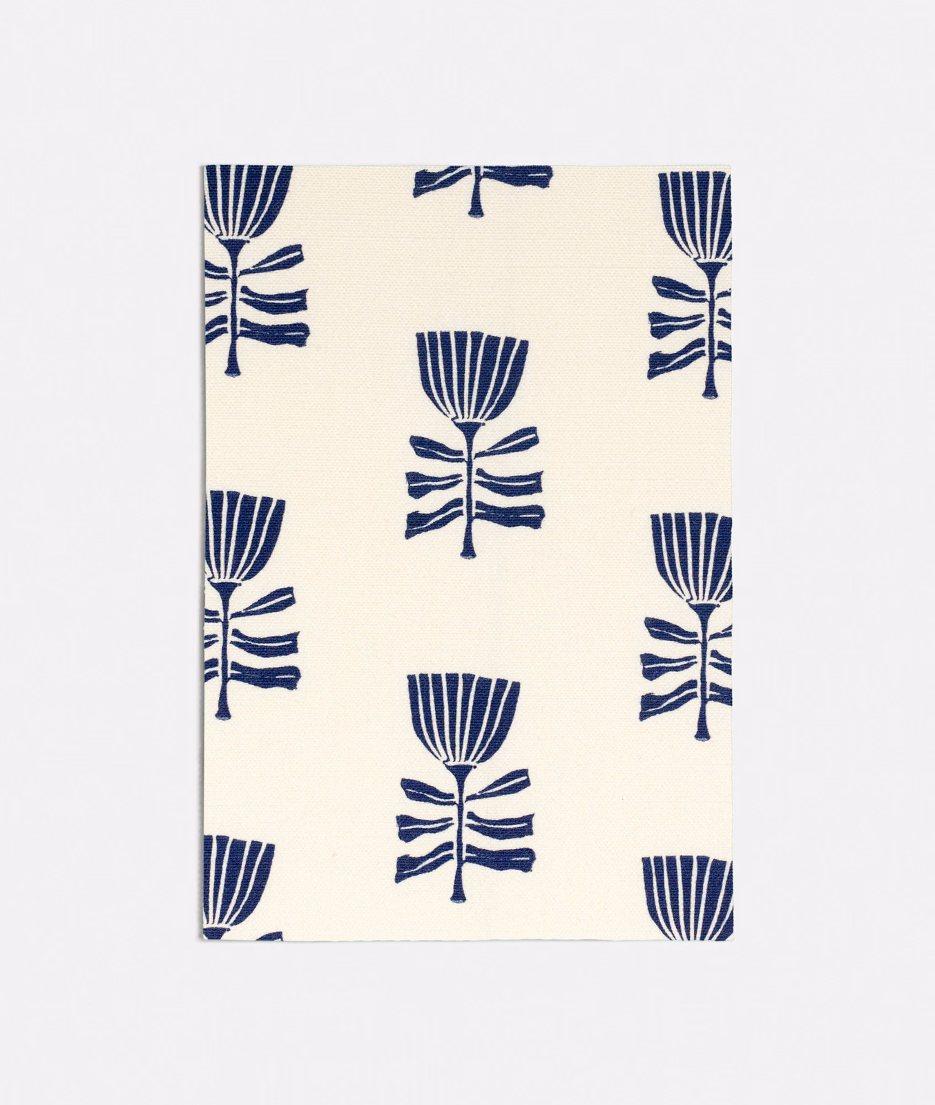 Cream textile with repeated deep navy stylised tulips and striped fan-shaped flower heads