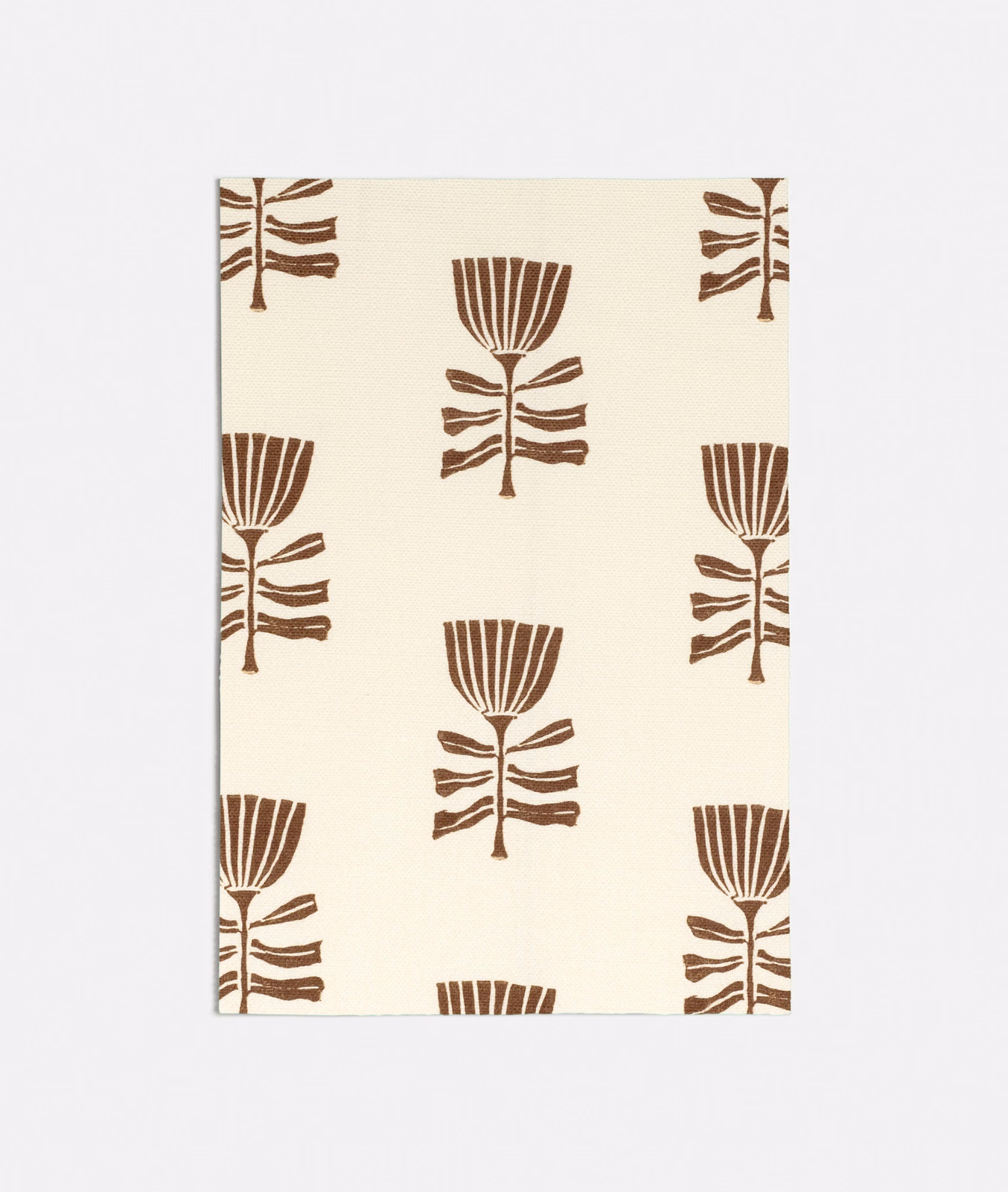 Warm cream fabric with repeated spice-brown stylised tulip and leaf motifs