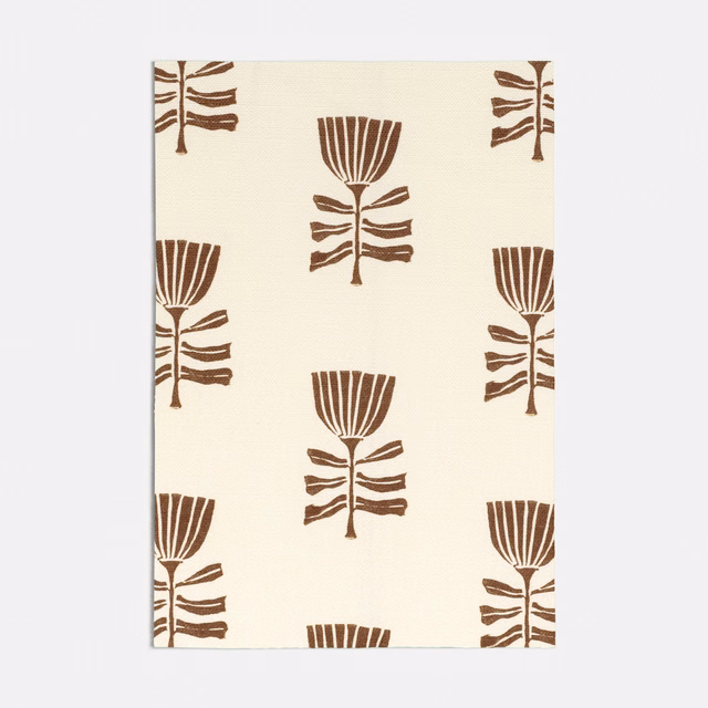 Warm cream fabric with repeated spice-brown stylised tulip and leaf motifs