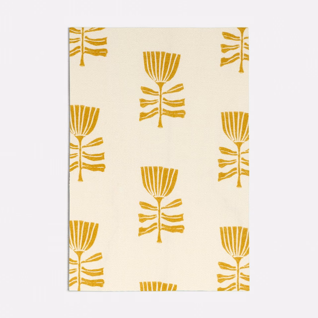 Warm cream fabric with repeating mustard-yellow stylised tulip motifs
